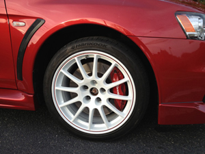 A red car with white rims